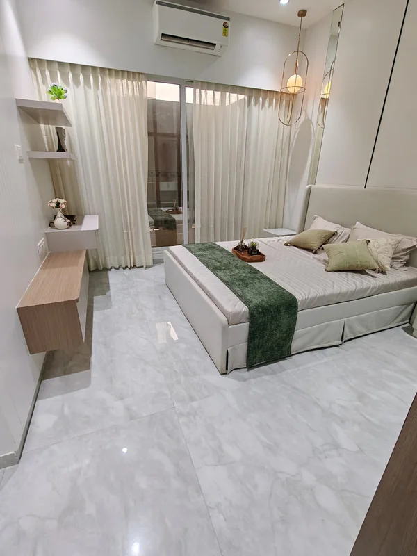 A bedroom in the show home at Provident Palm Vista