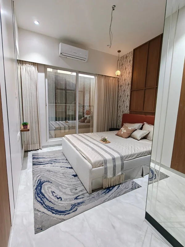 The larger bedroom in the show home at Provident Palm Vista
